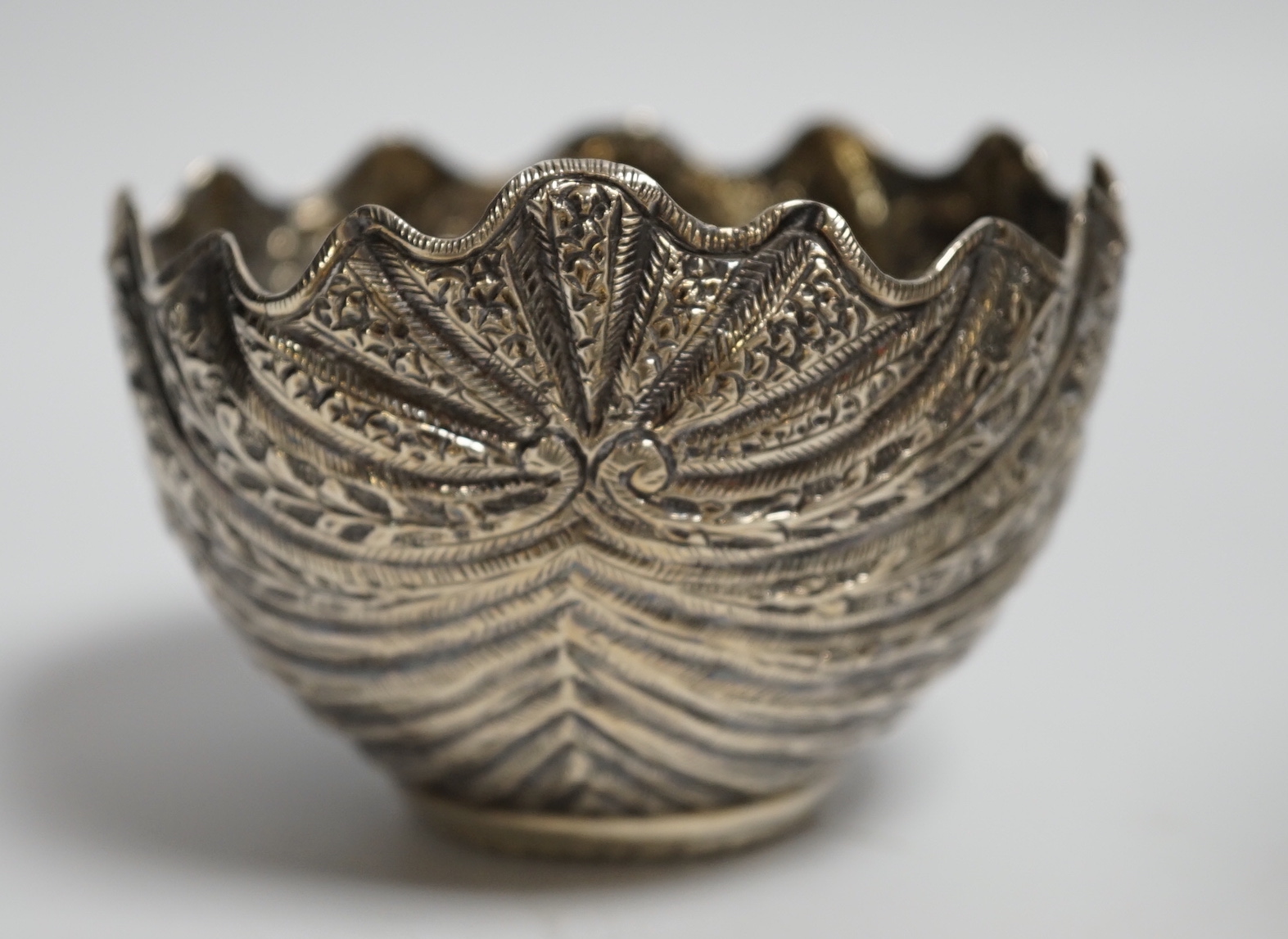 A George II silver waiter, Henry Morris, London, 1747, 17.6cm, together with an Indian? white metal baluster mug and a white metal small bowl.